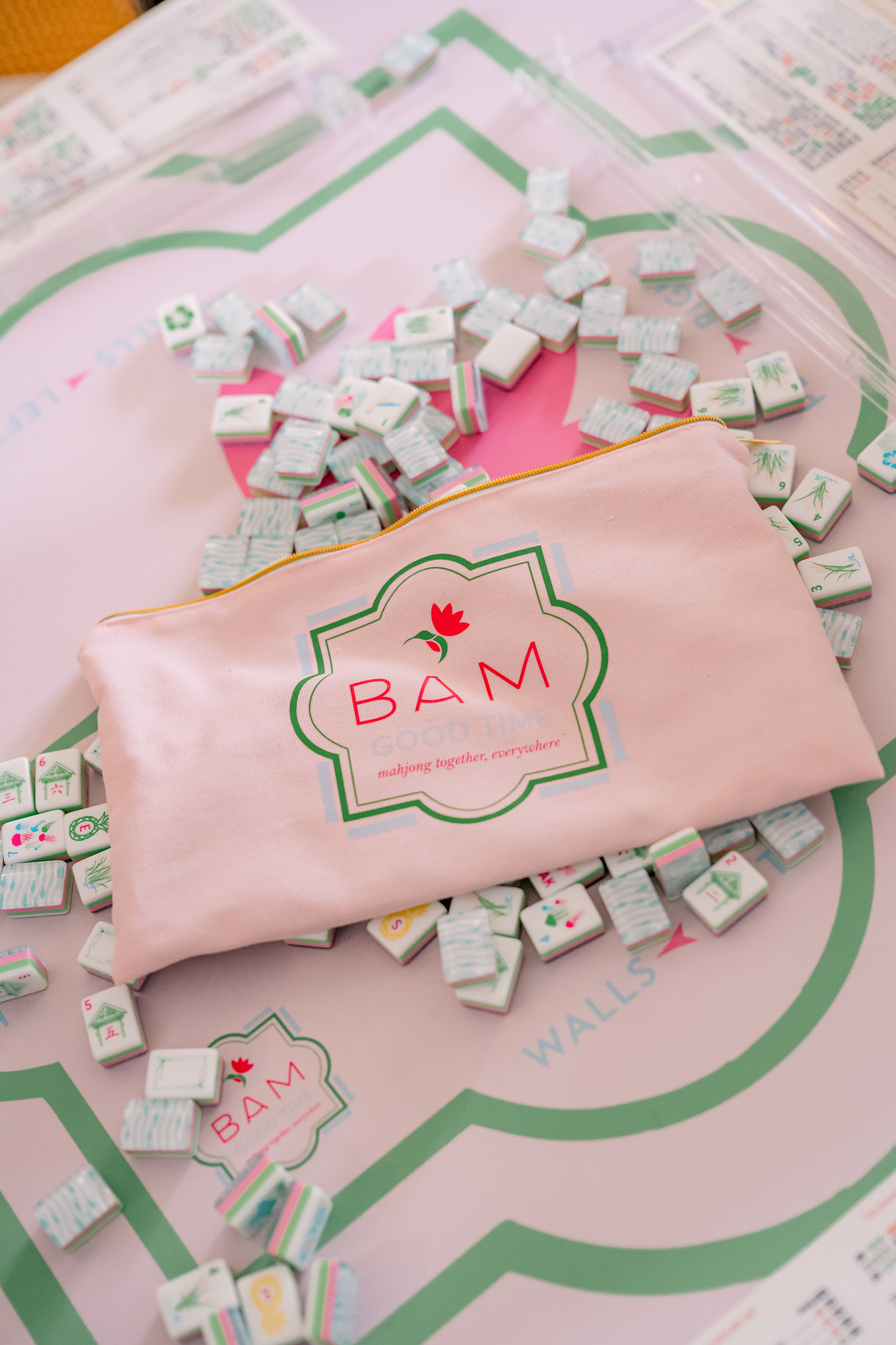 A Bam Good Time tile pouch on a mahjong mat with tiles around it