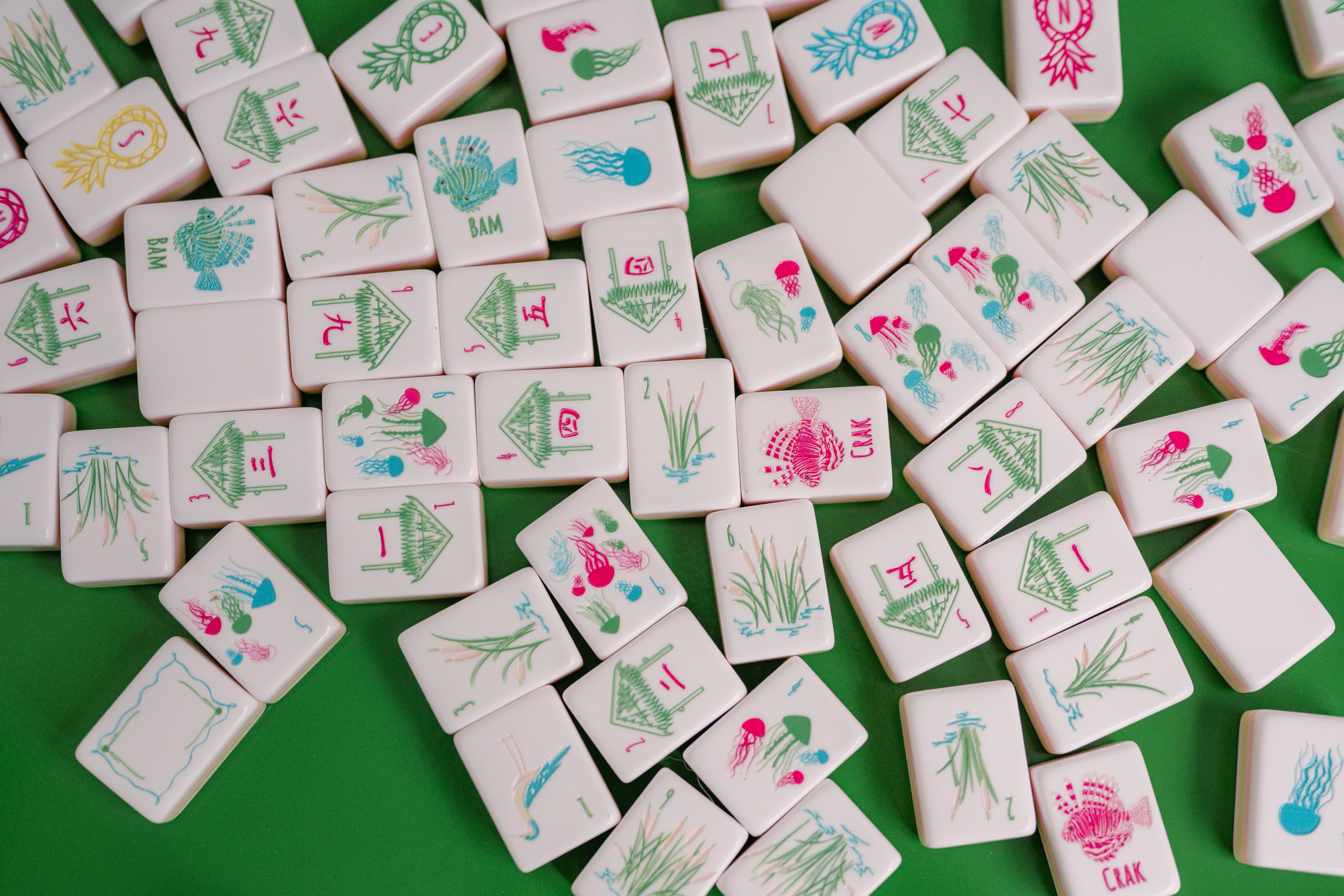 Bam Good Time tiles spread face up on a green table